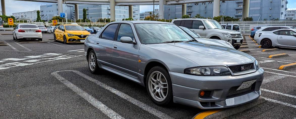 An R33 Nissan Skyline GT-R Sedan, Autech Version, at Daikoku Parking Area in Yokohama, Japan
