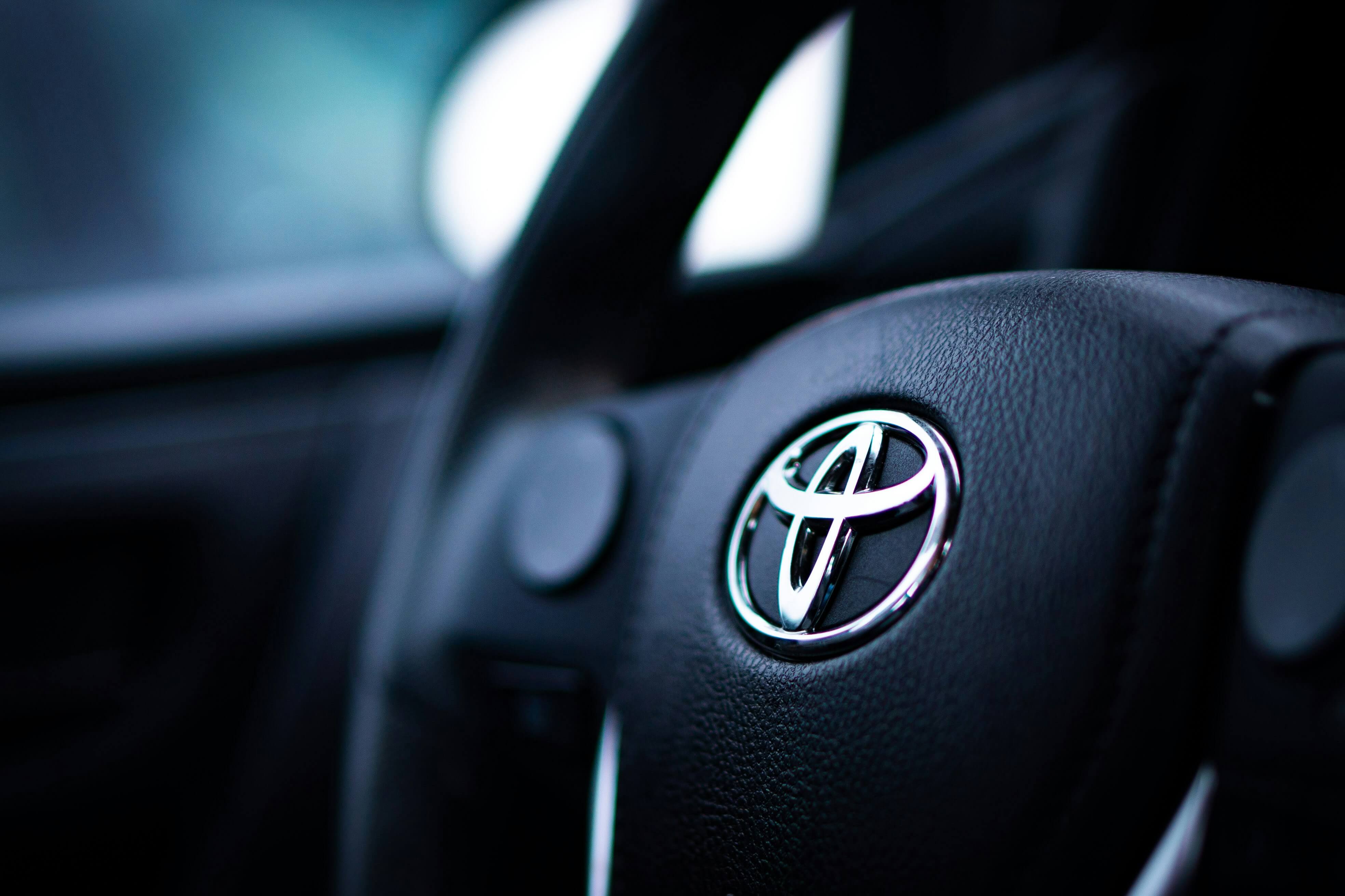 Close up image of a Toyota steering wheel from a Japanese import car. 