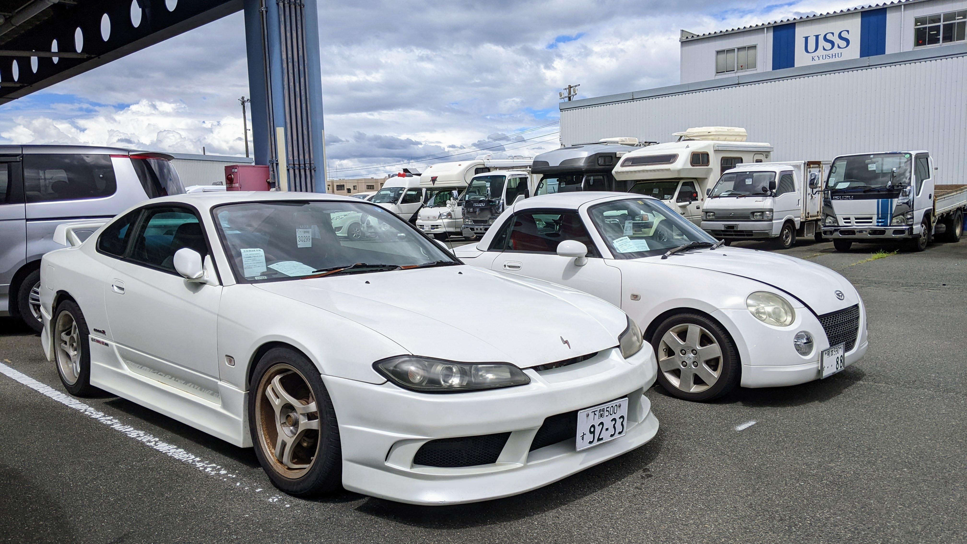 A Nissan Silvia and Daihatsu Copen at USS Kyushu auction house in Japan. 