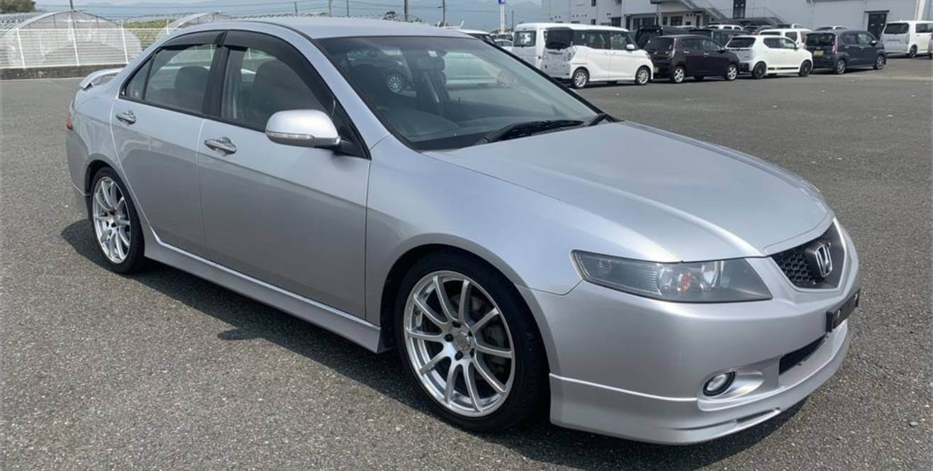 A silver Honda Accord Euro R CL7 with aftermarket wheels.