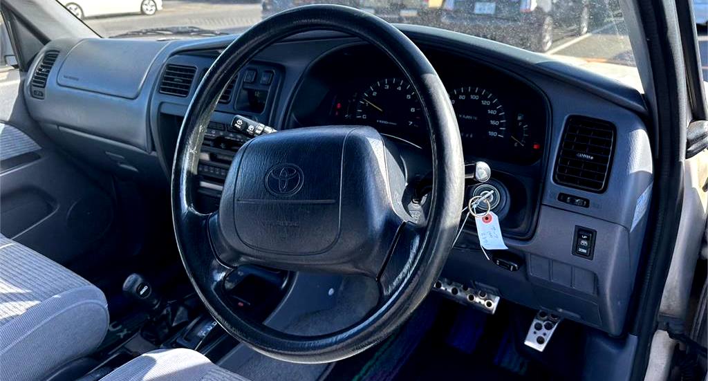 2nd Generation Toyota Hilux Surf Interior View, Steering Wheel, Gauges, and Center Console